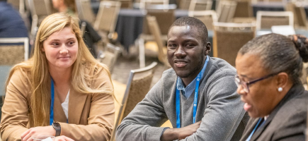 Meeting attendees networking at a table